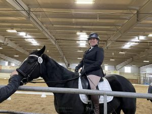Online student Kelly competing her horse.
