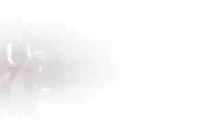 A faint, misty image of a person riding a horse, both partially obscured by a white, foggy haze. The rider wears a helmet and vest; the 2024 scene appears calm and ethereal, evoking the quiet focus of early mornings on the training scale.