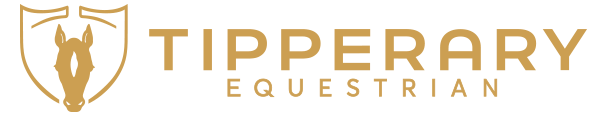 Tipperary Equestrian logo with a gold horse head in a shield, TIPPERARY in bold gold above EQUESTRIAN; evokes dressage elegance.