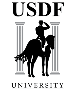 A logo with the letters USDF at the top, a rider saluting on a horse in front of two pillars, and the word UNIVERSITY at the bottom. The black, white, and gray design highlights dressage and horse training.