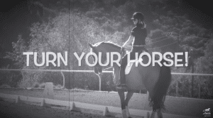 A person wearing a helmet rides a Dressage horse in an outdoor arena, with the large text TURN YOUR HORSE! overlaid on the black-and-white image. Trees and hills are visible in the background, highlighting dressage training and how to turn.